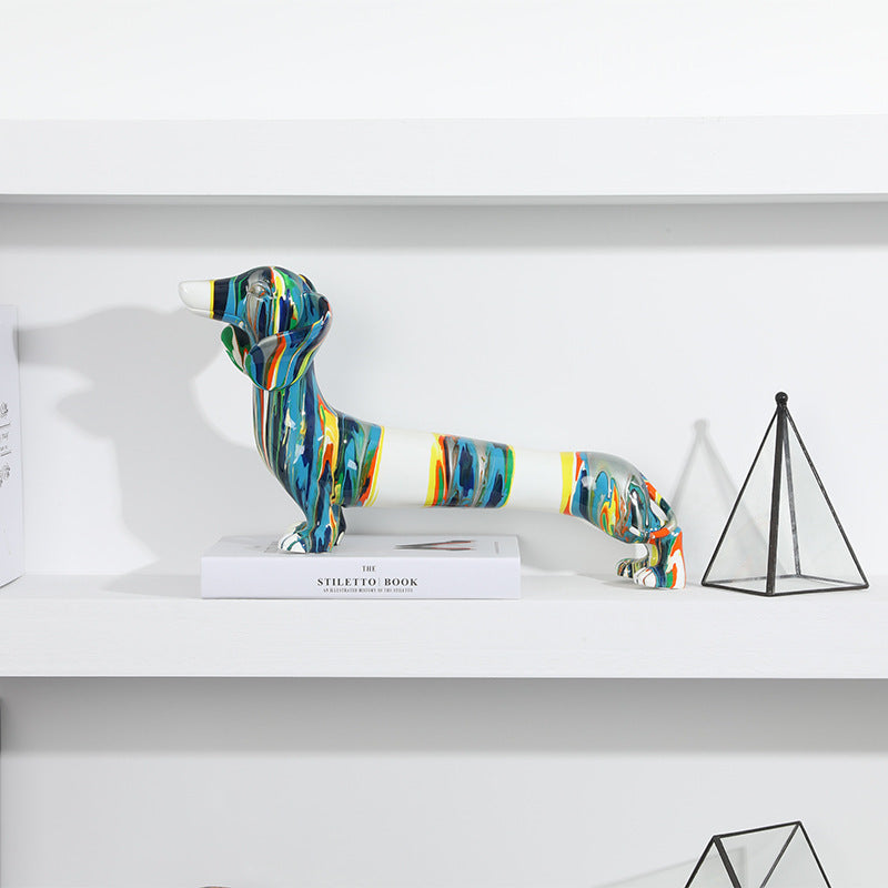 Artigianato in resina colorata, animale, cane bassotto