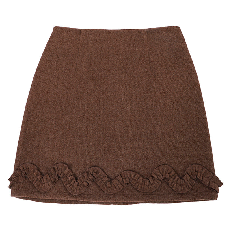 Gonna corta con orlo arricciato in tinta unita